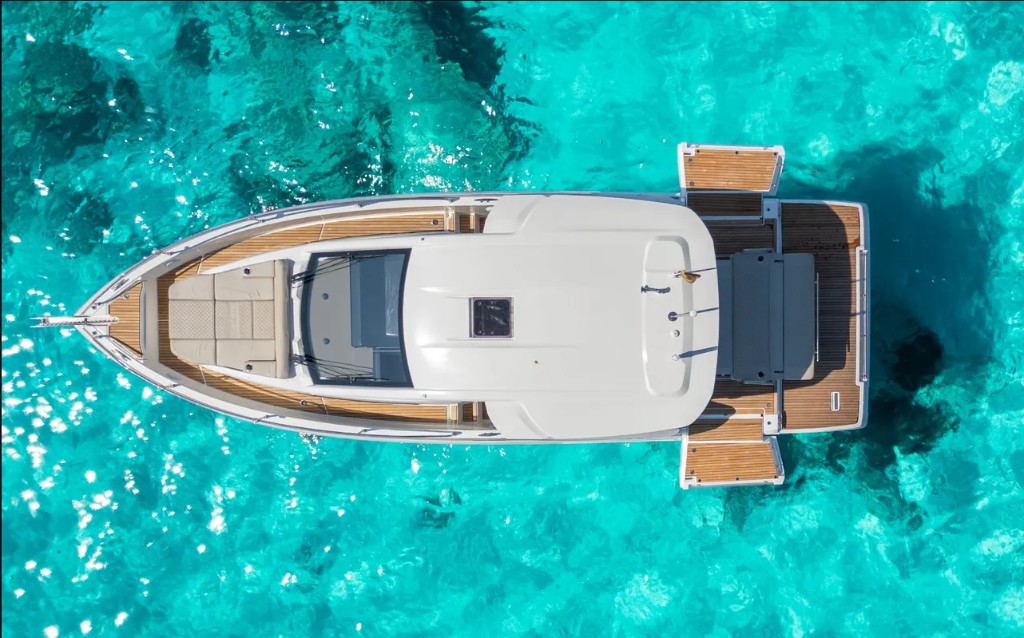 Aerial view of yacht on turquoise Balearic waters